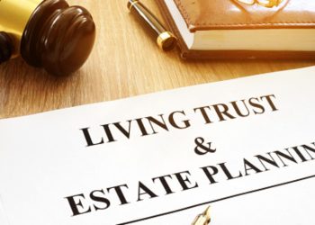 Living trust and estate planning form on a desk.