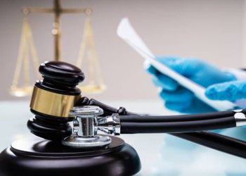 Medical Malpractice Litigation. Lawyer Or Judge In Courtroom